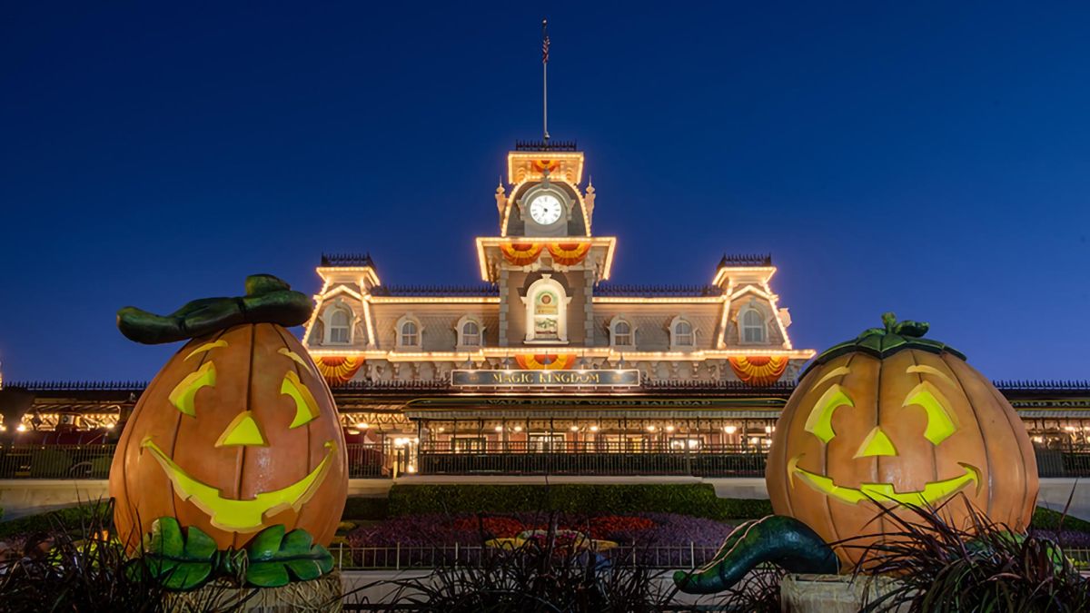 Giant jack-o’-lanterns outside the entrance to Walt Disney World's Magic Kingdom.