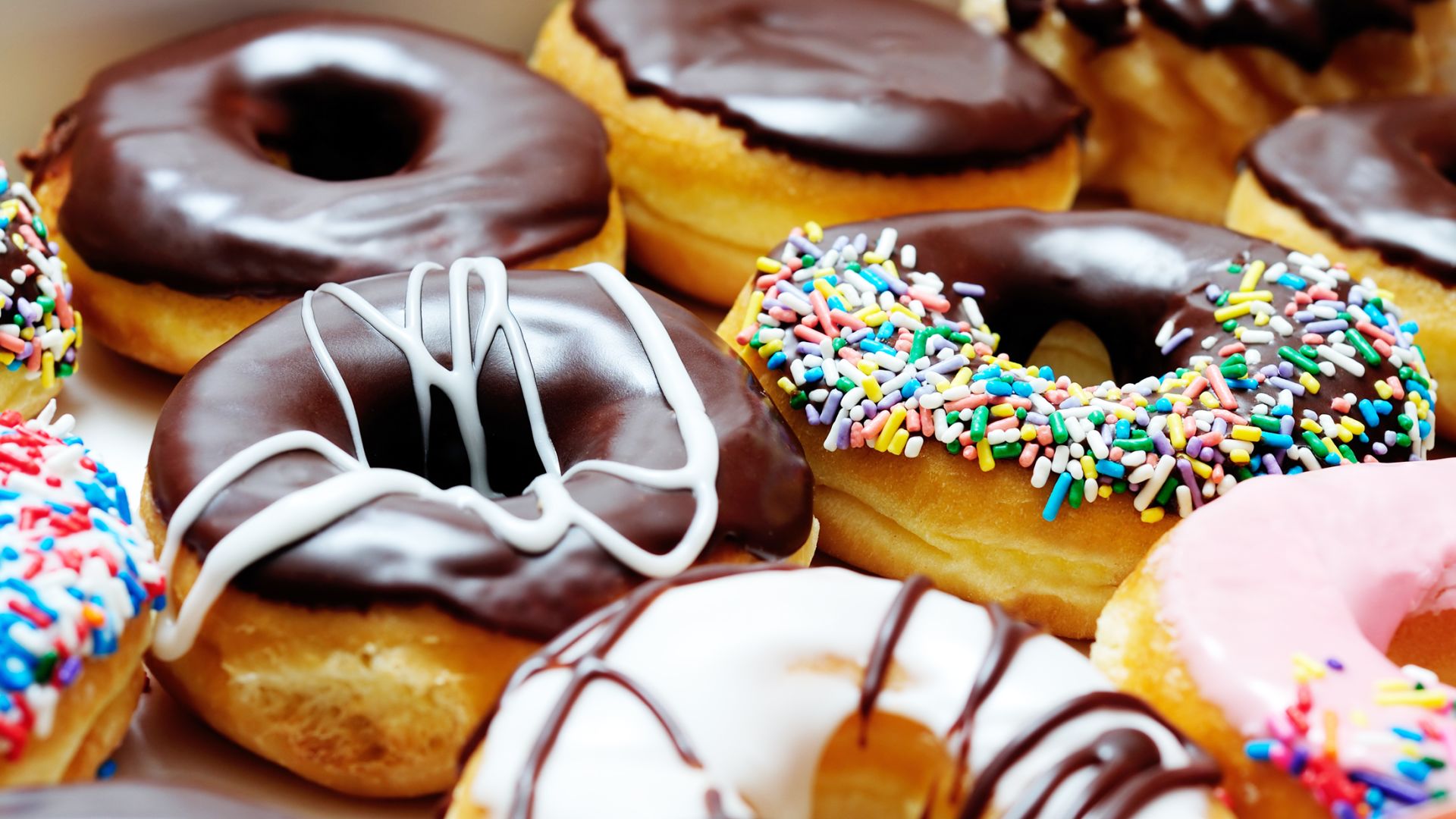 A Box Filled With Different Kinds Of Donuts