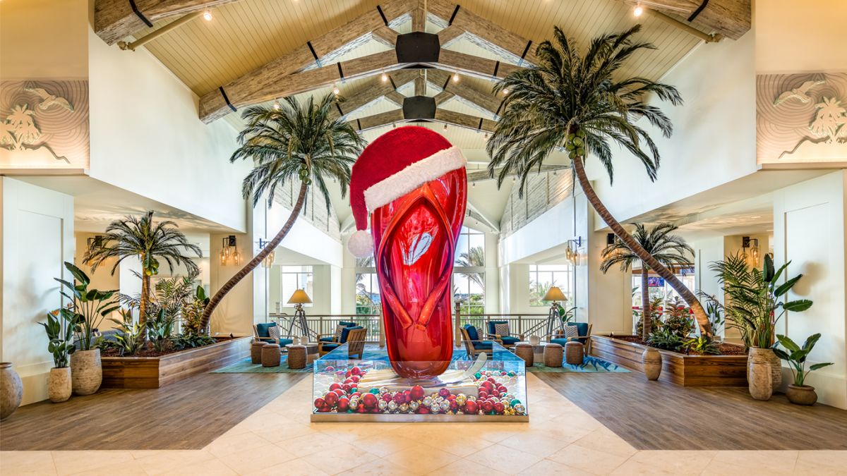 Santa Claus hat on top of Margaritaville Resort Orlando’s giant flip flop sculpture.