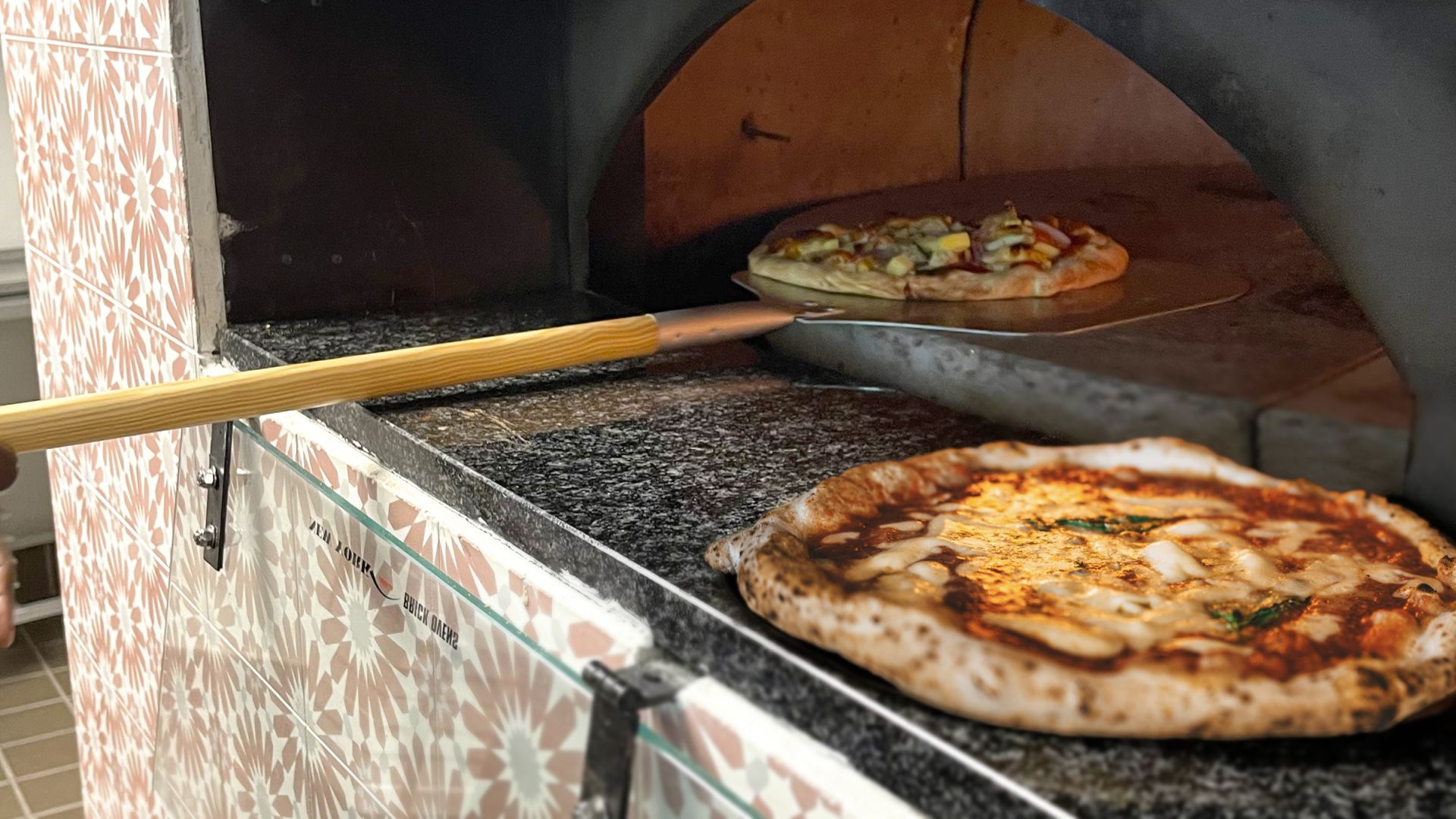 A Pizza Sitting On Top Of A Stove