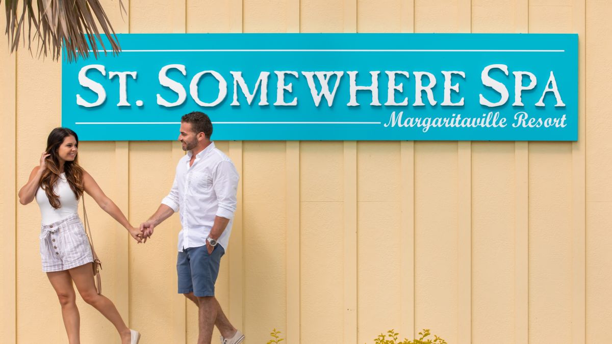 Couple Walking Outside St. Somewhere Spa At Margaritaville Resort Orlando.