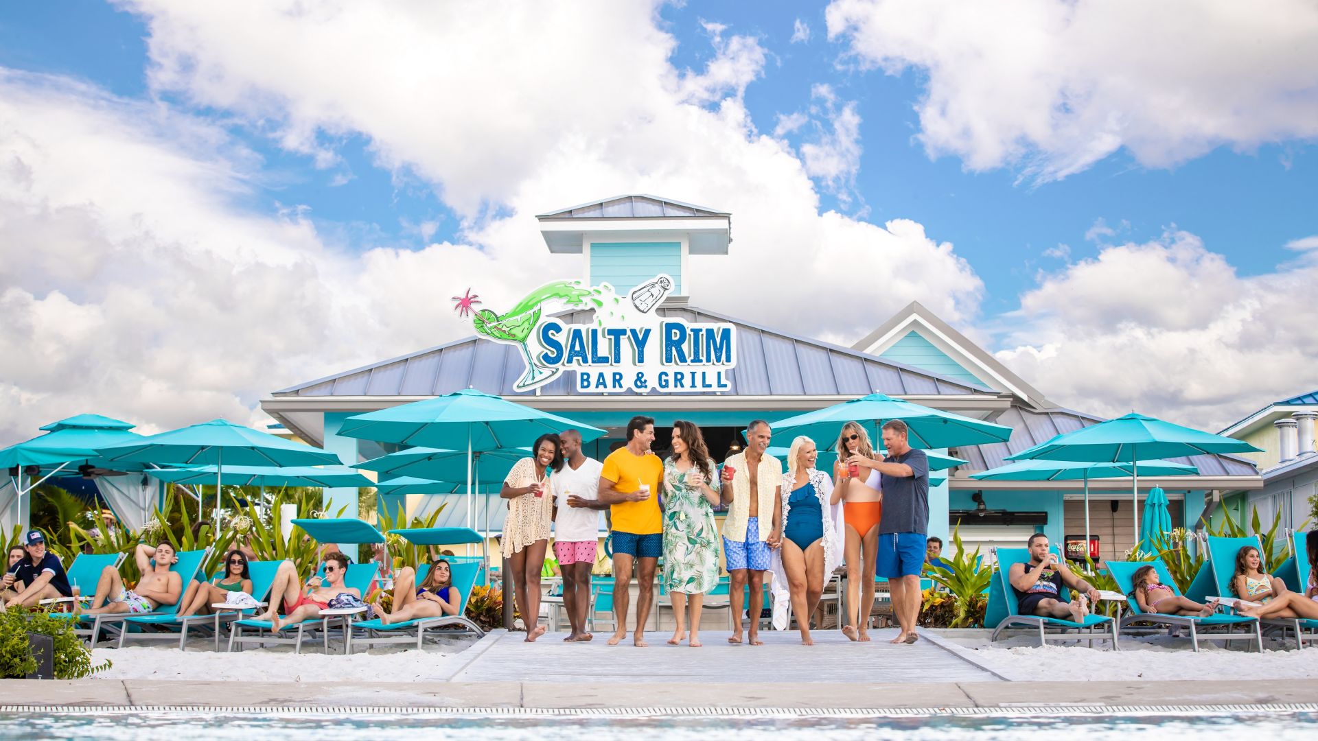 Guests Relax By The Pool Outside Of The Salted Rim Bar And Grill.