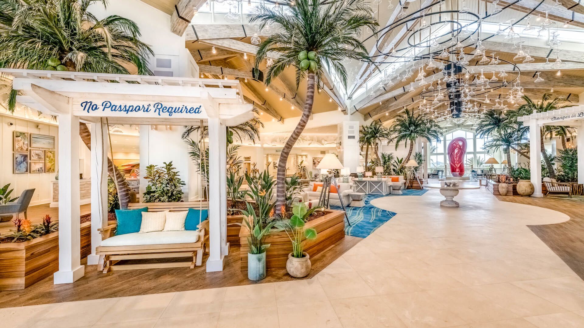 The Margaritaville Resort Orlando hotel lobby, featuring a sign that reads 'No Passport Required.'