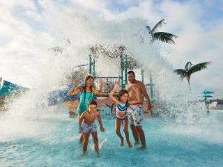 A Group Of People Getting Splashed at the Waterpark