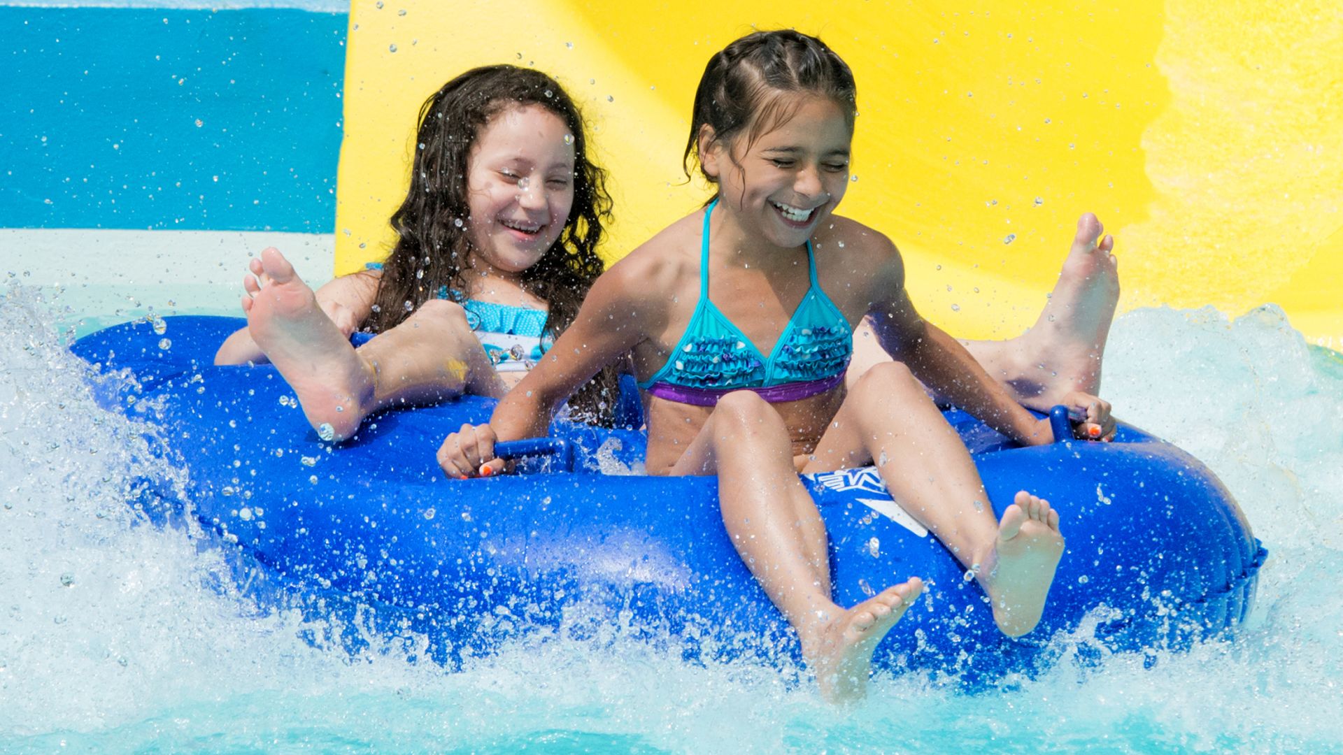 A Young Girl Riding A Wave Pool