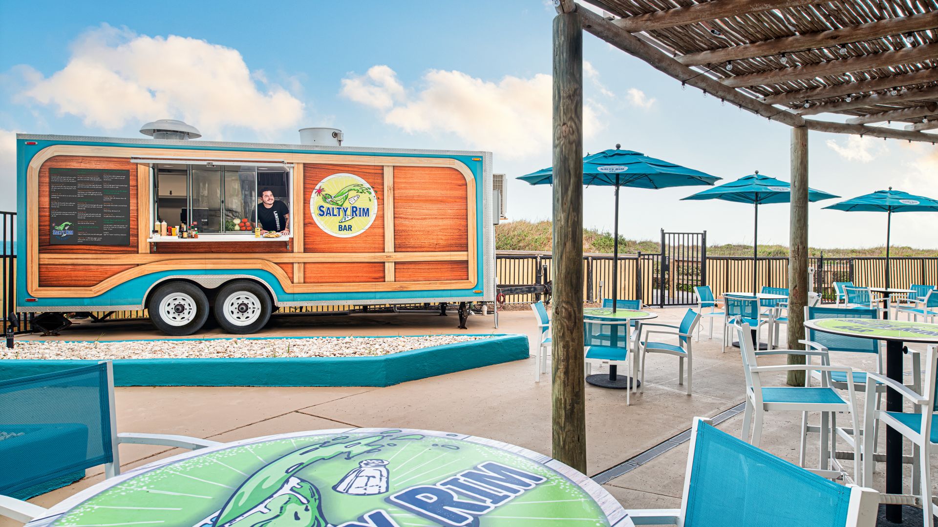 A Food Truck Parked At A Beach