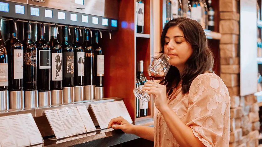 Woman doing a wine tasting in the Wine Room | Winter Park, Florida