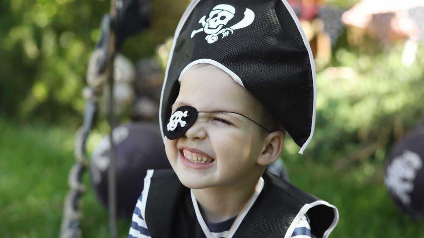 Young boy wearing a pirate costume
