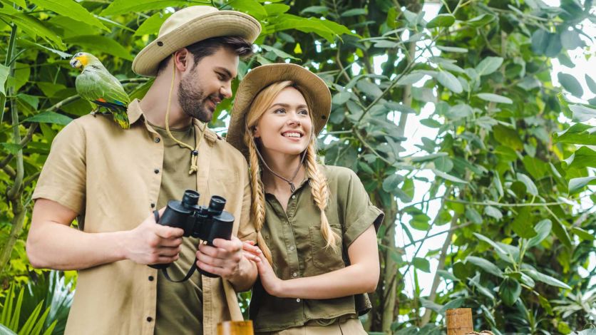 Couple dressed in jungle explorer attire 