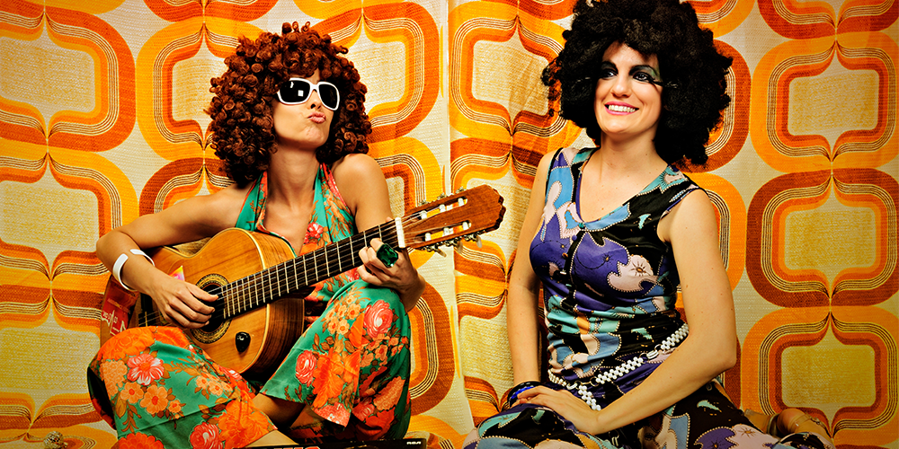 Two Women With A Guitar